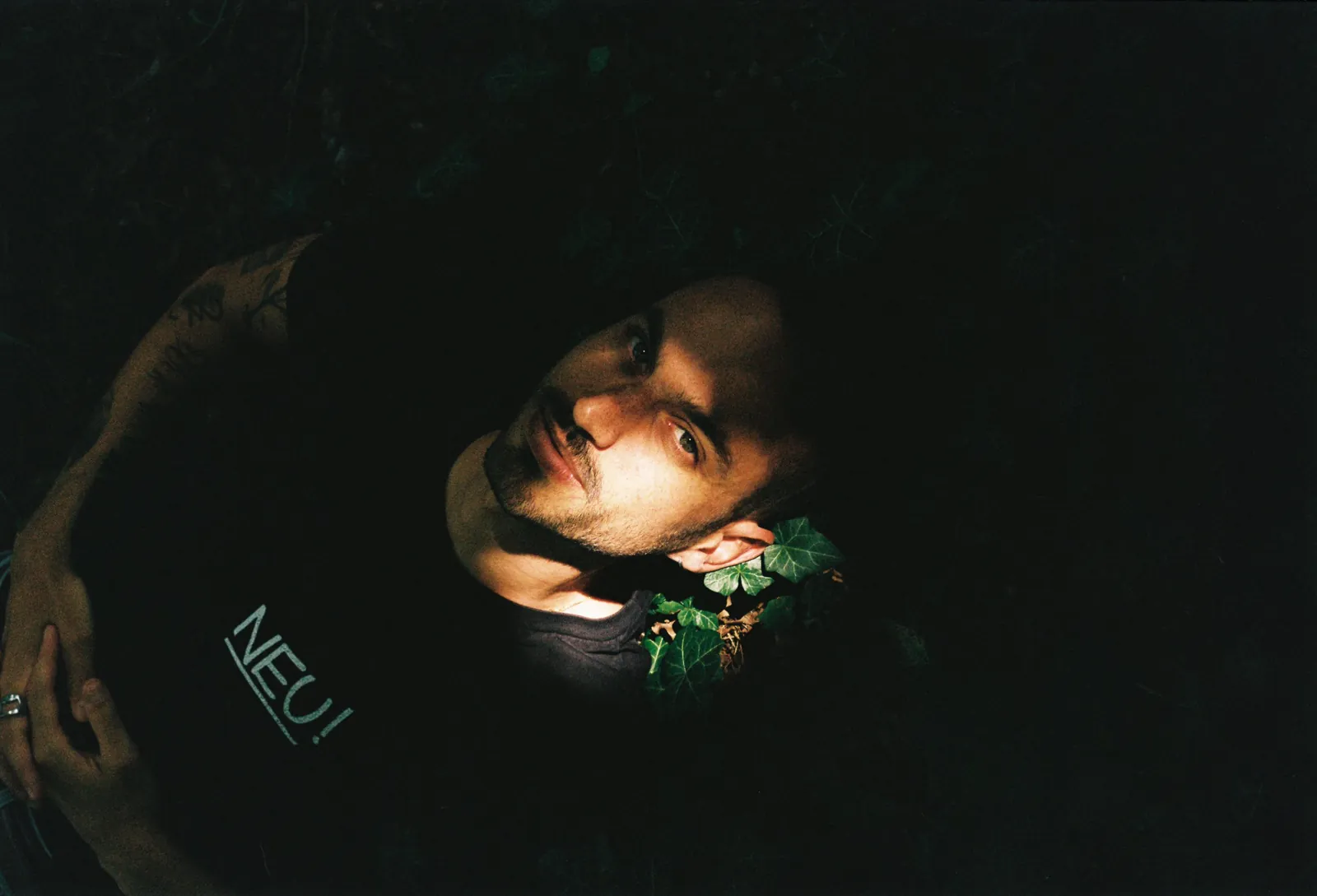 Portrait at night among ivy