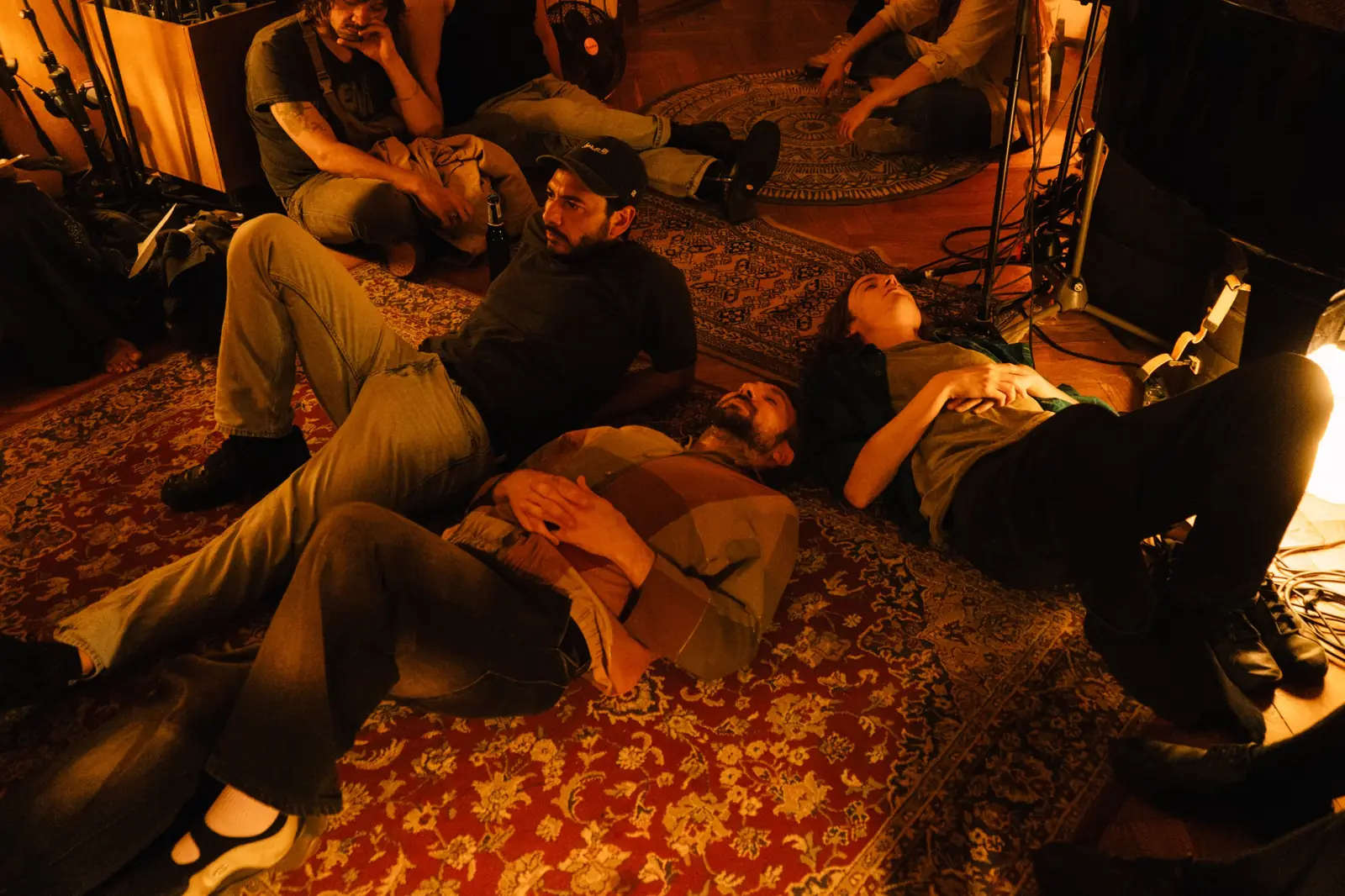 Listeners lying on the studio rugs